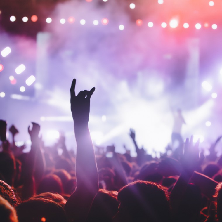 hands in the air at a rock concert
