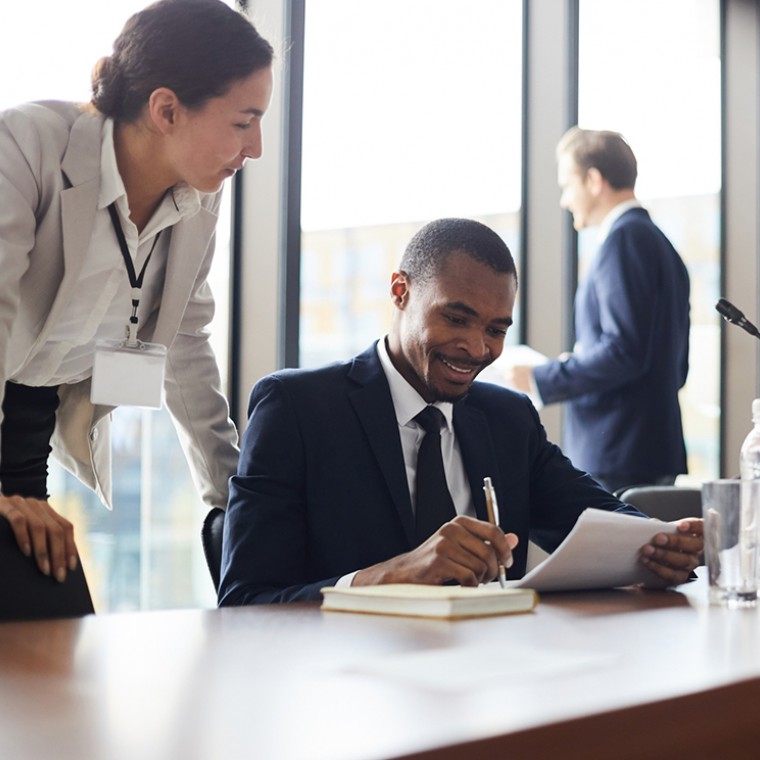Business people gathered at table