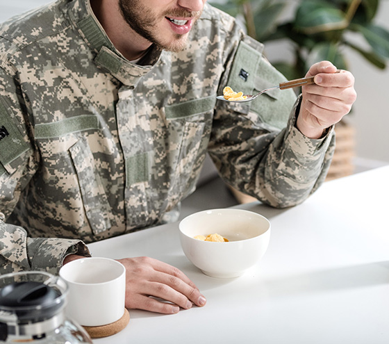 Man in uniform enjoying food