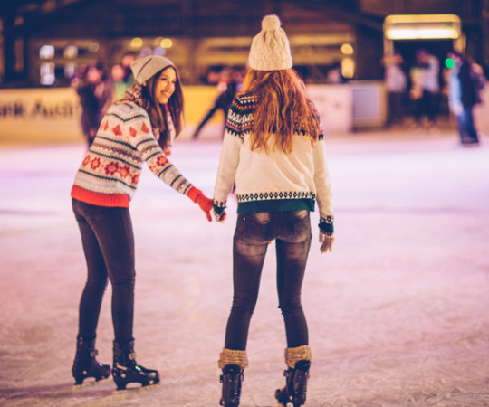 two girls ice skating