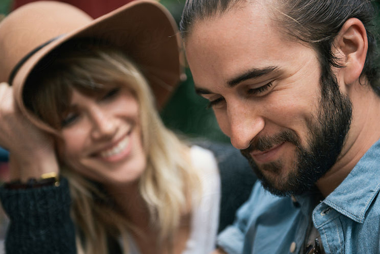 man and woman laughing