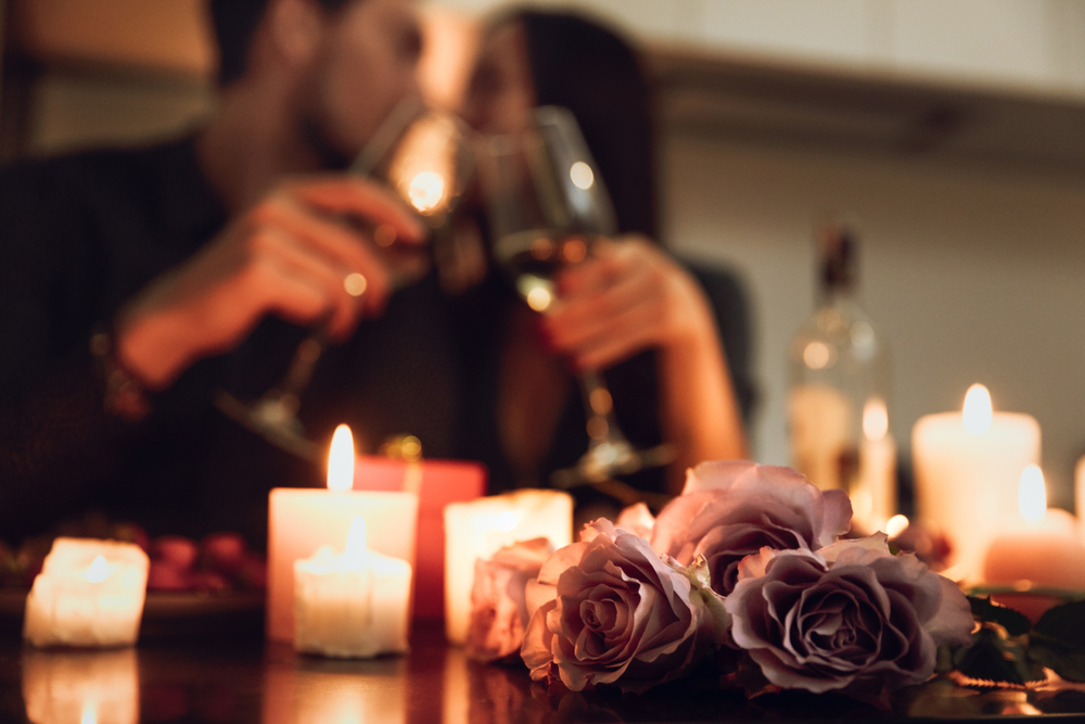 couple has romantic candlelit dinner