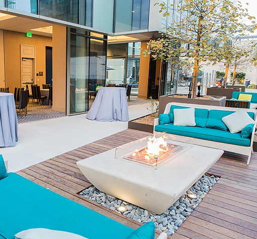 View of a big terrace with confortable sofas and a fireplace