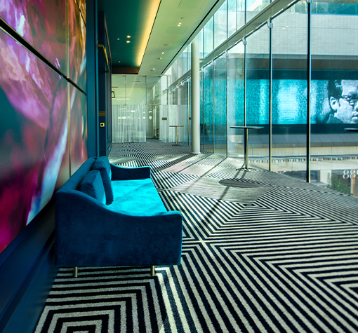 View of a chick hall with a big blue sofa