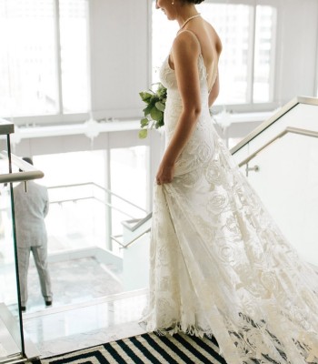 View of a beautiful bride walking down the stairs 