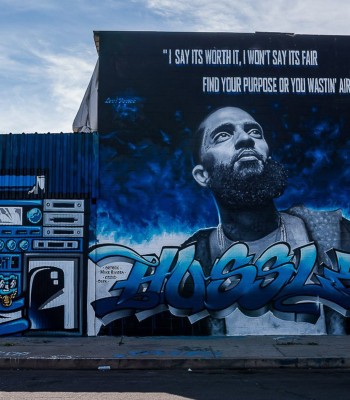 View of a huge blue graffiti dedicated to Nipsey Hussle