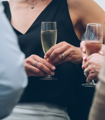 Closeup of some people drinking champagne 