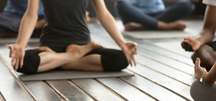 a person doing a yoga pose on their mat