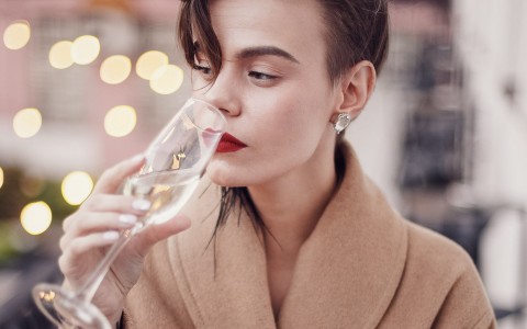 a woman drinking champange