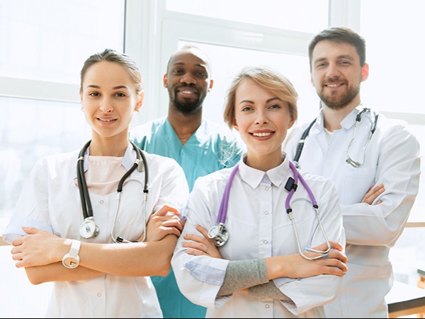 medical staff in uniform and smiling
