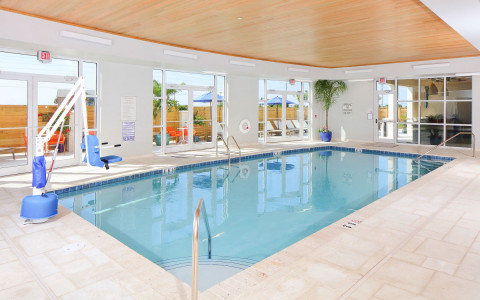 indoor pool area with outside window views