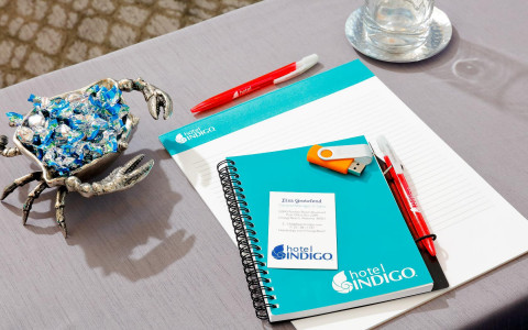 blue notepad with hotel logo