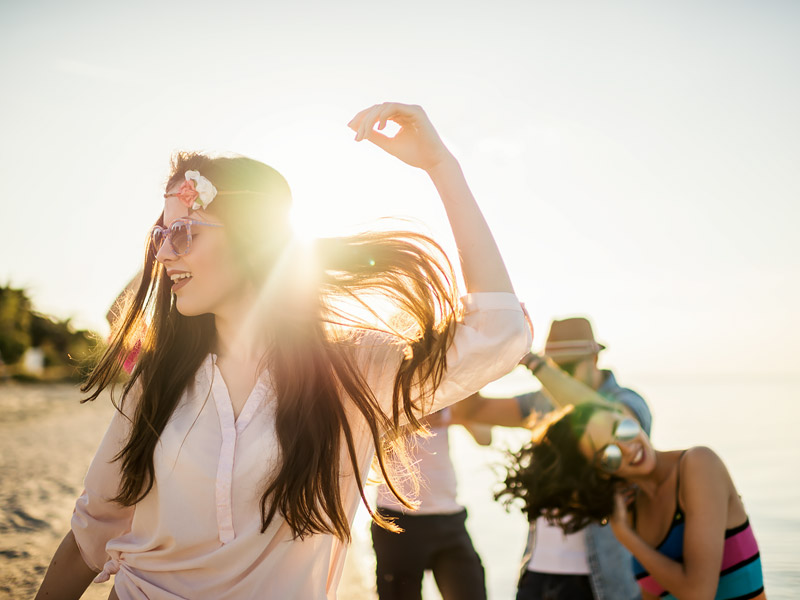 women dancing on the beach