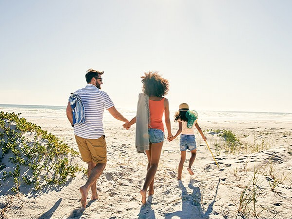 Family heading to the beach