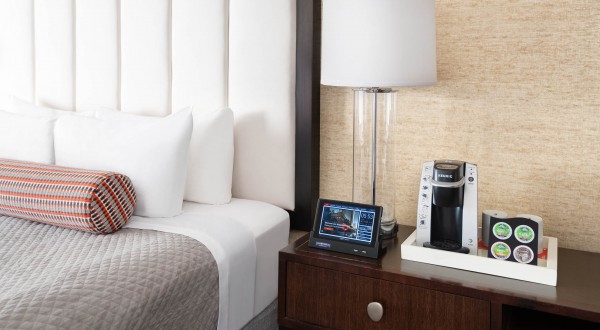 nightstand with tablet and coffee machine