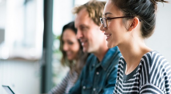 three people in a meeting