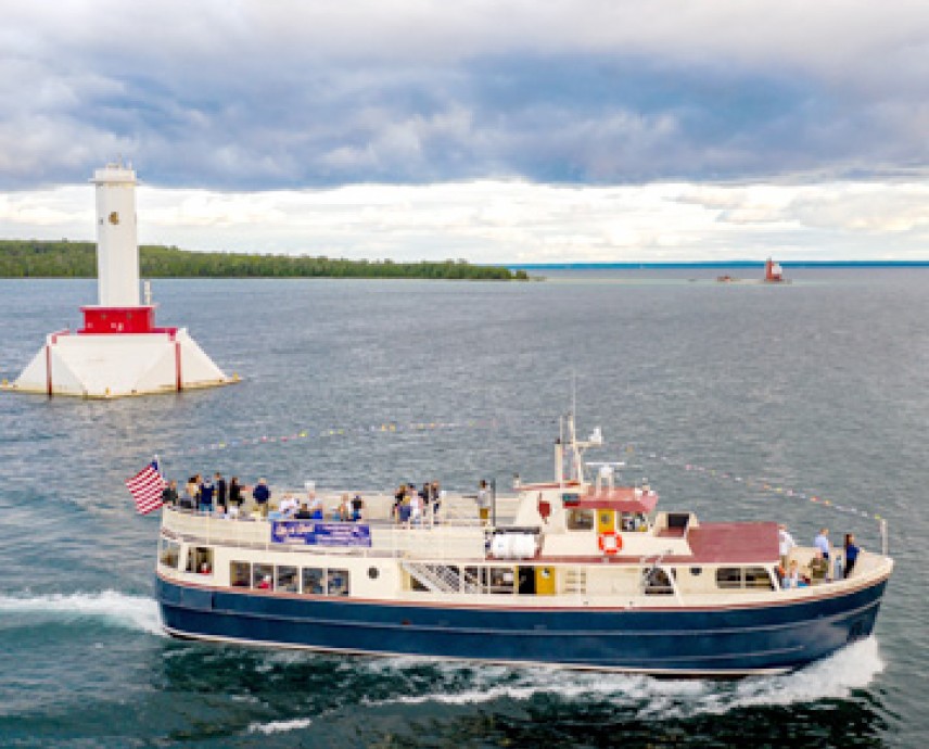 overhead view of a white and blue ferry