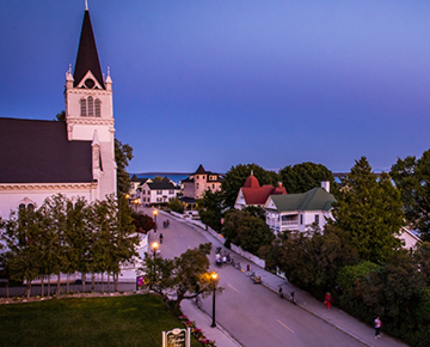 overhead view of the street in the evening with the water in the distance