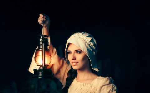 medieval woman with vintage lantern
