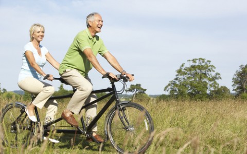 older couple on tandem bicycle