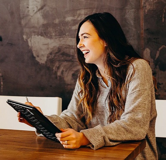 smiling woman reading a book