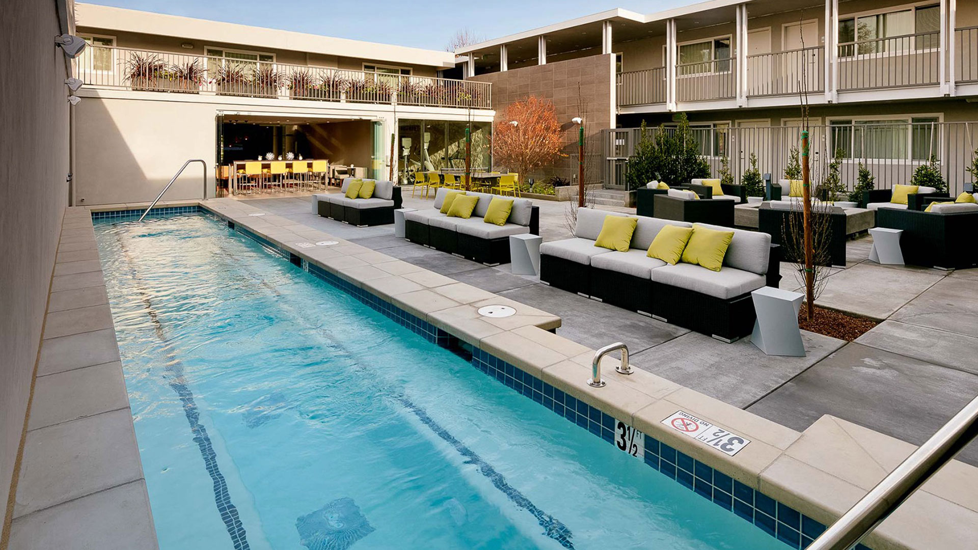 outdoor long lap pool with seating
