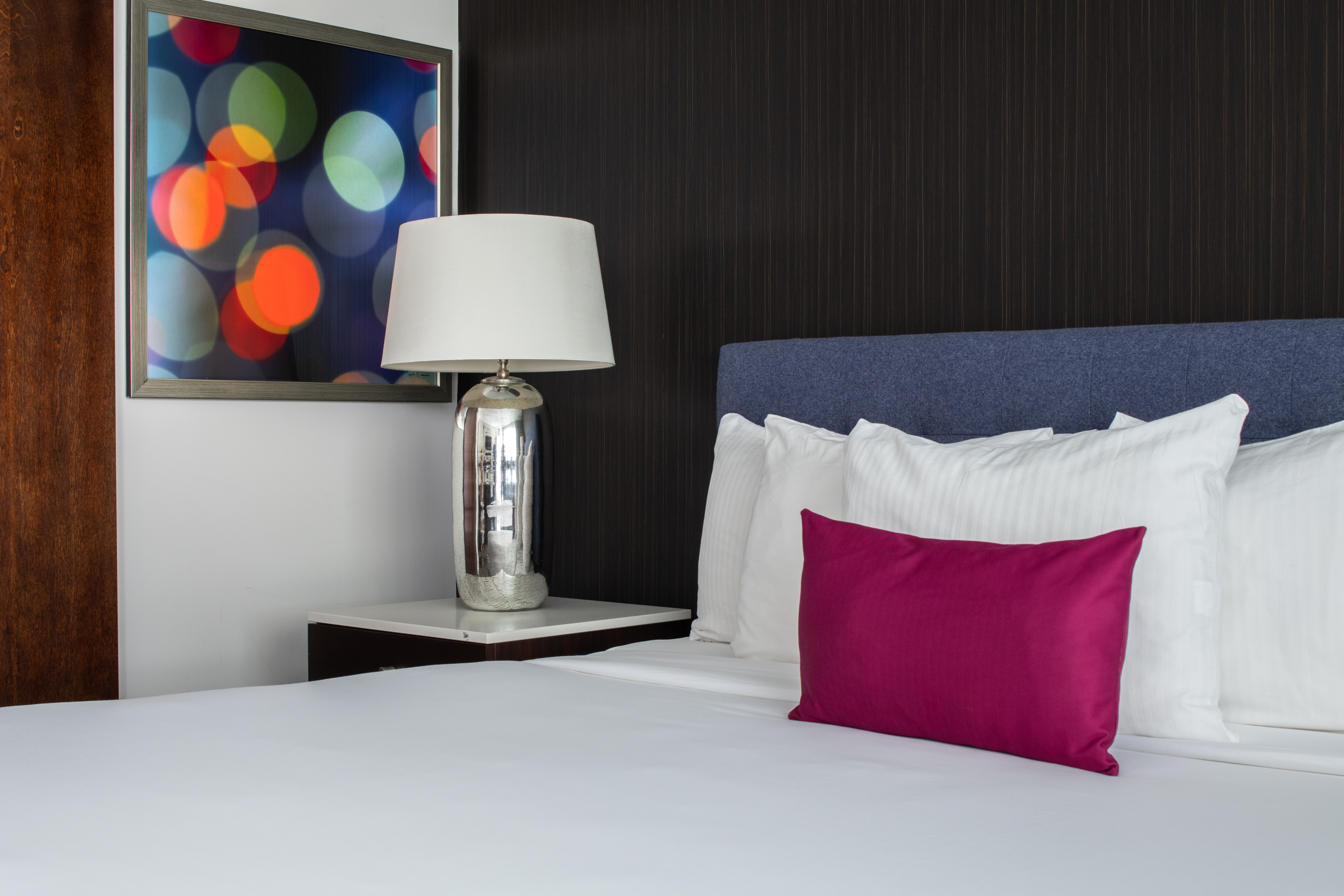 hotel lucent guestroom bed vignette