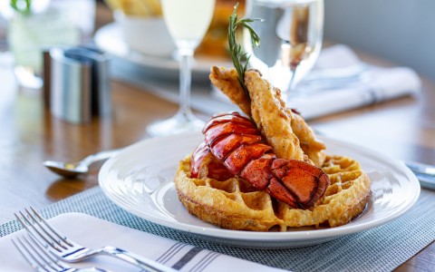 lobster tail on top of waffle