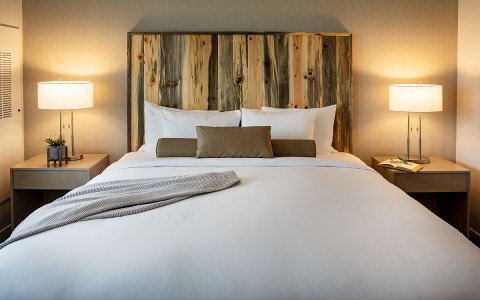 bed with wooden headboard