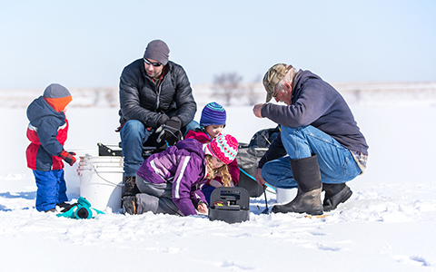family of five ice fishing