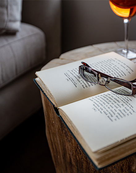 reading glasses sitting on top of open book