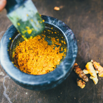 orange shavings in a marble bowl