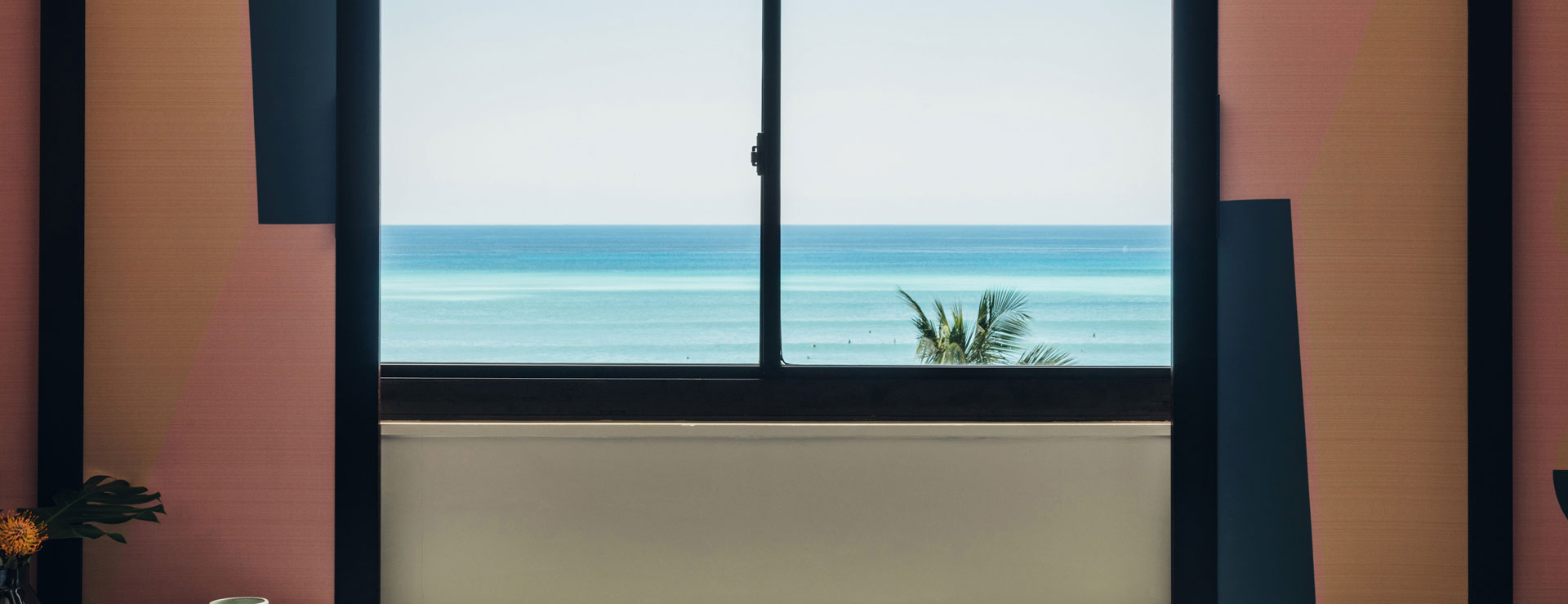 ocean view with pink window shades