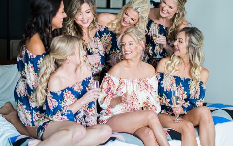 bride sitting with her bridesmaids 