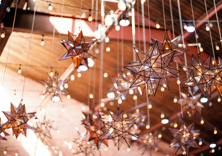 view of a ceiling with decorative stars hanging from it