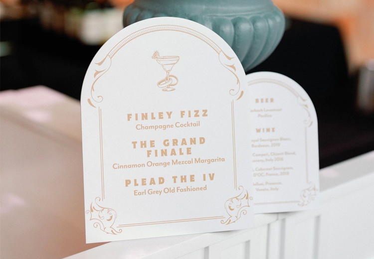 a sheet with the bar menu with finley fizz, the grand finale and plead the iv as drinks