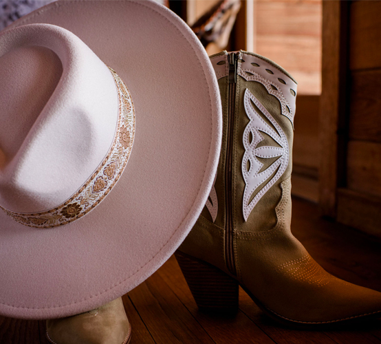 cowboy boots with a hat on top
