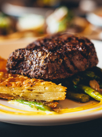 close up view to a piece of steak with asparagus 