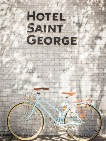 hotel saint george sign with a bike beneath 