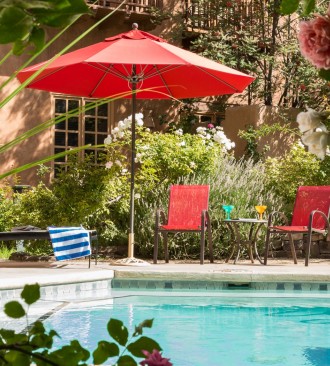 pool patio with red umbrella
