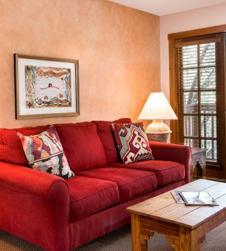 couch and table with view to balcony