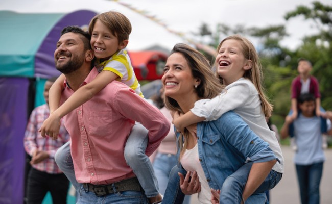 happy family having fun at an amusement park