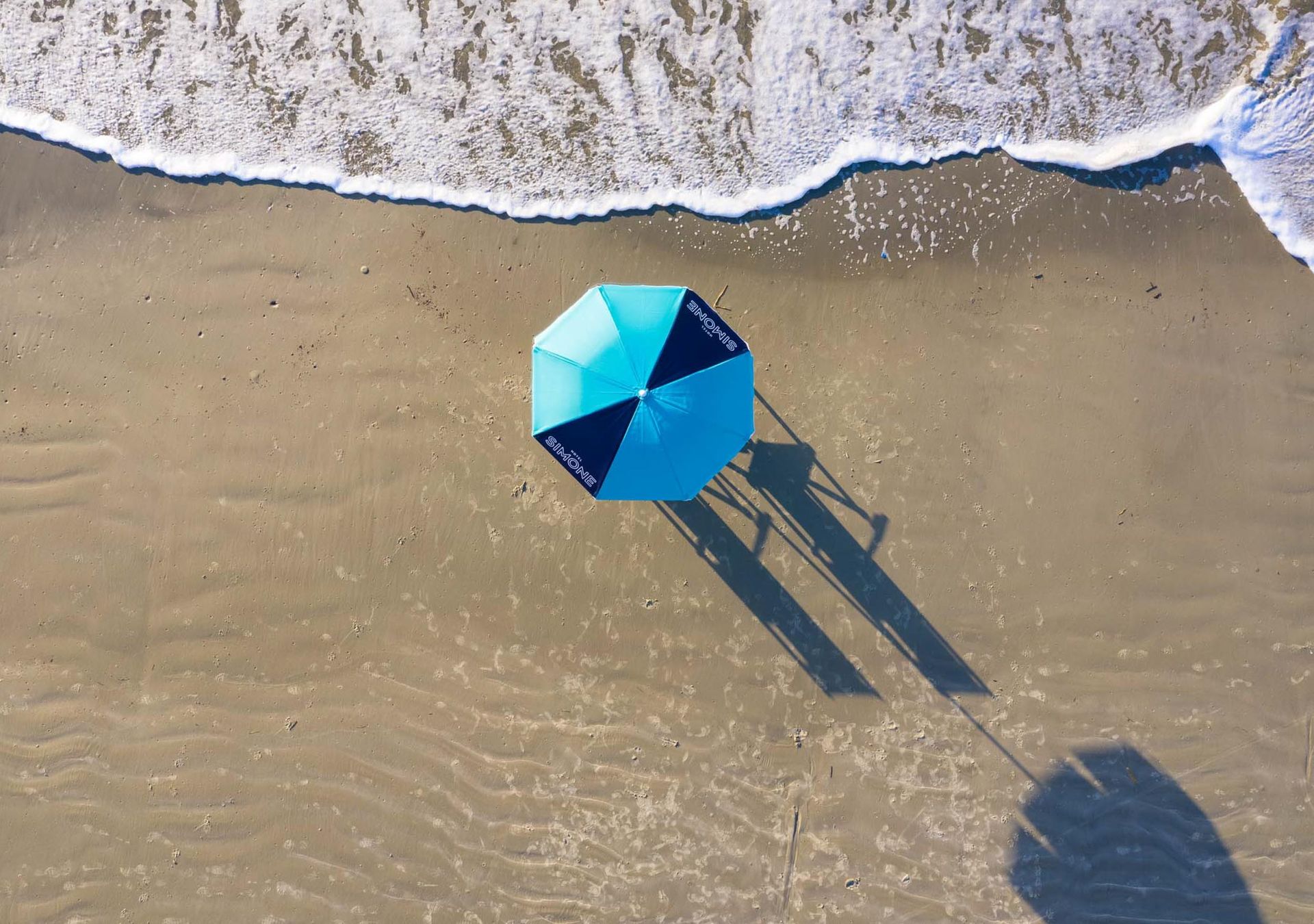 instagram beach with umbrella in sand