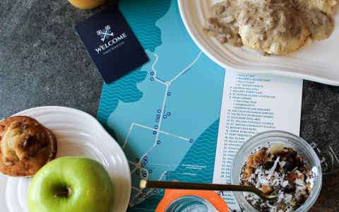 breakfast dishes on a resort map with a hotel room key next to it
