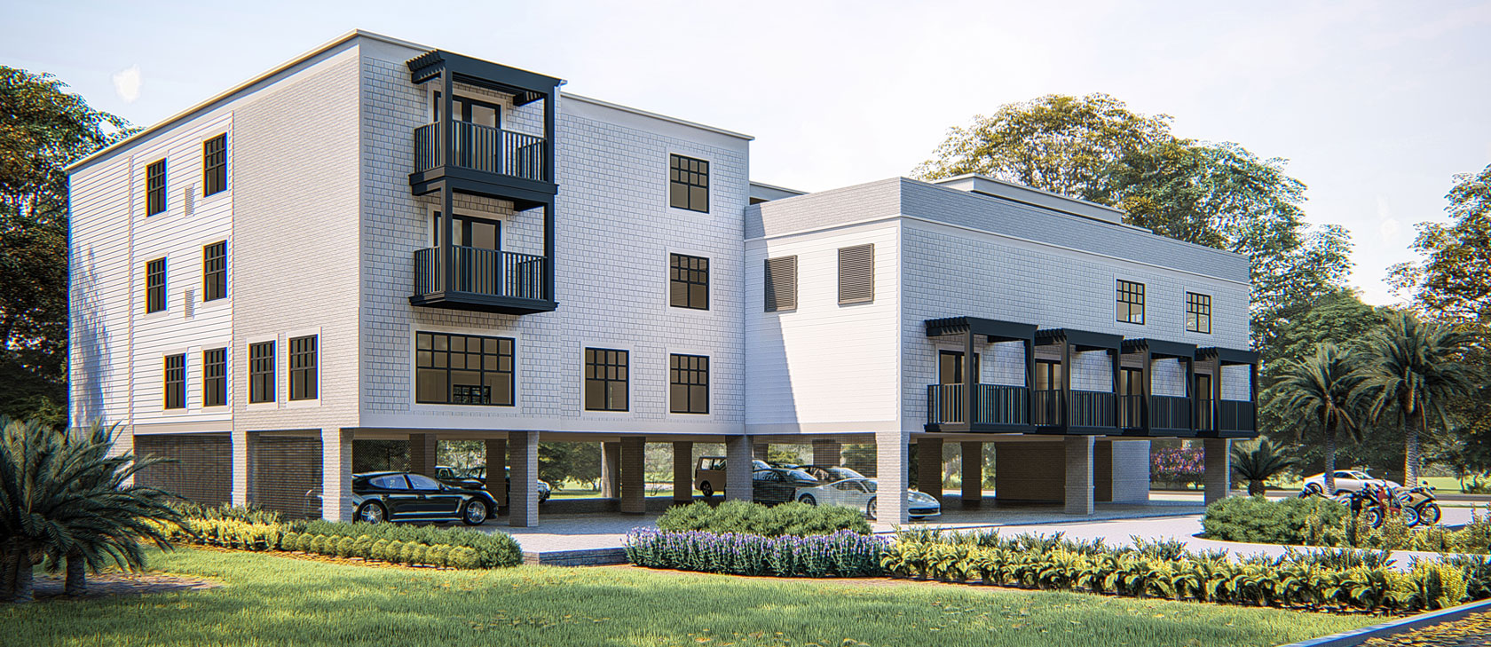 White square 4 story building with parking on the ground level under the building above