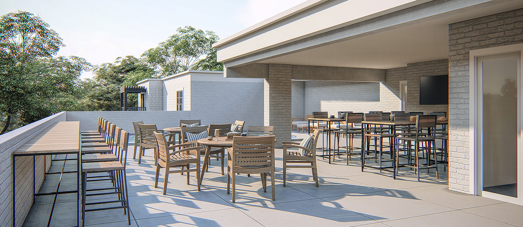 Wooden tables and chairs in an outdoor bar setting with the bar under cover