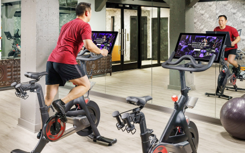 Man on stationary bike in workout room