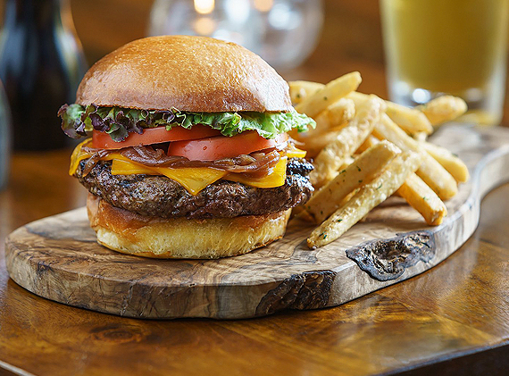 burger and french fries on wooden board