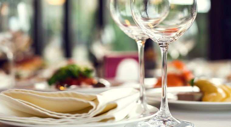 table setting with plates napkins and glasses