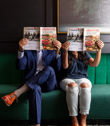 couple holding magazines